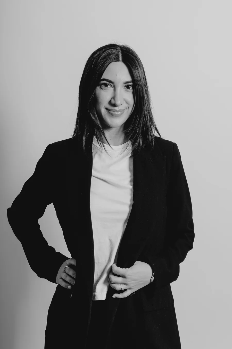 Black-and-white front-facing blazer portrait of Dr. Milena Arakelyan